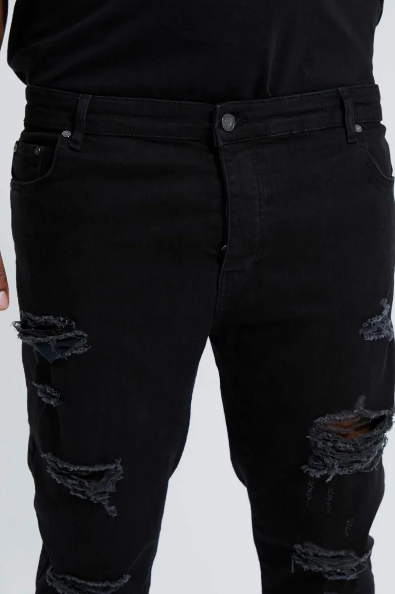 Shop boohooMAN Plus Skinny Stretch All Over Rip Jeans true black