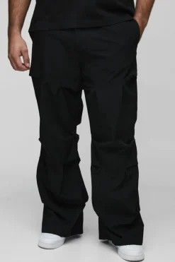 Shop boohooMAN Plus Slim Fit Flare Stacked Trouser With Ruched Detail black