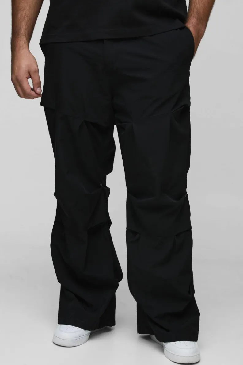 Shop boohooMAN Plus Slim Fit Flare Stacked Trouser With Ruched Detail black