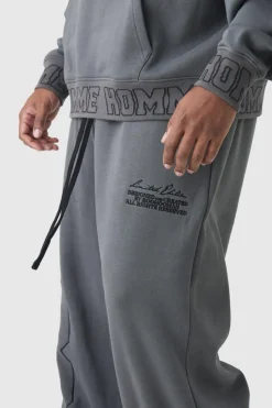 Outlet boohooMAN Plus Wide Leg Homme Embroidered Varsity Joggers charcoal