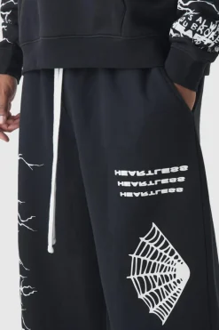 Shop boohooMAN Plus Wide Leg Print Joggers black