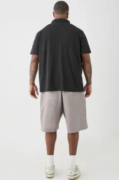 Shop boohooMAN Plus 1/4 Zip Pique Polo black