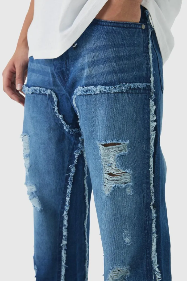 Clearance boohooMAN Raw Edge Rip & Repair Carpenter Panel Relaxed Fit Flared Jeans mid blue
