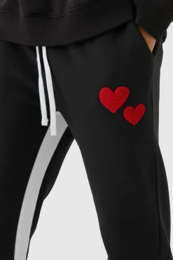 Shop boohooMAN Regular Fit Heart Borg Applique Gusset Jogger black