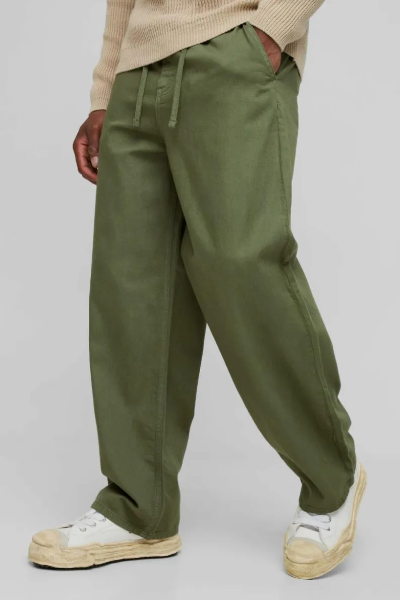 Store boohooMAN Relaxed Chinos With Drawcords In khaki