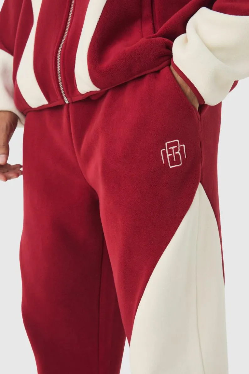 Store boohooMAN Relaxed Colour Block Polar Fleece High Gusset Jogger burgundy