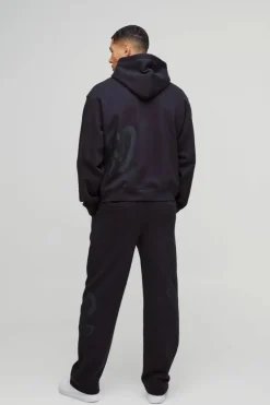 Store boohooMAN Relaxed Fit All Over Heart Printed Jogger black