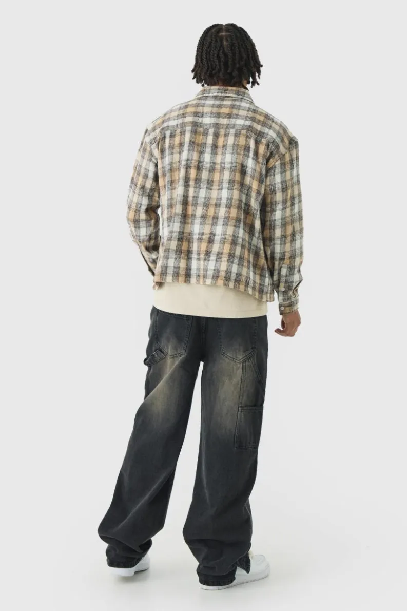 Store boohooMAN Relaxed Fit Carpenter Jeans With Split Hem brown