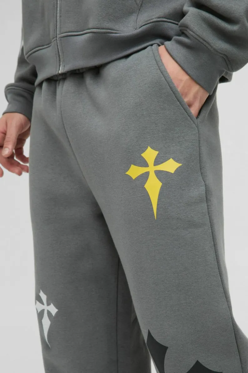 Shop boohooMAN Relaxed Fit Cross Embroidered Printed Jogger charcoal
