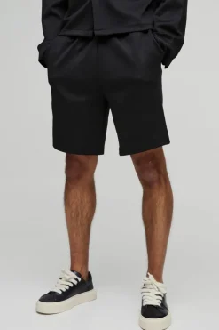 Shop boohooMAN Relaxed Fit Elasticated Waist Scuba Short black