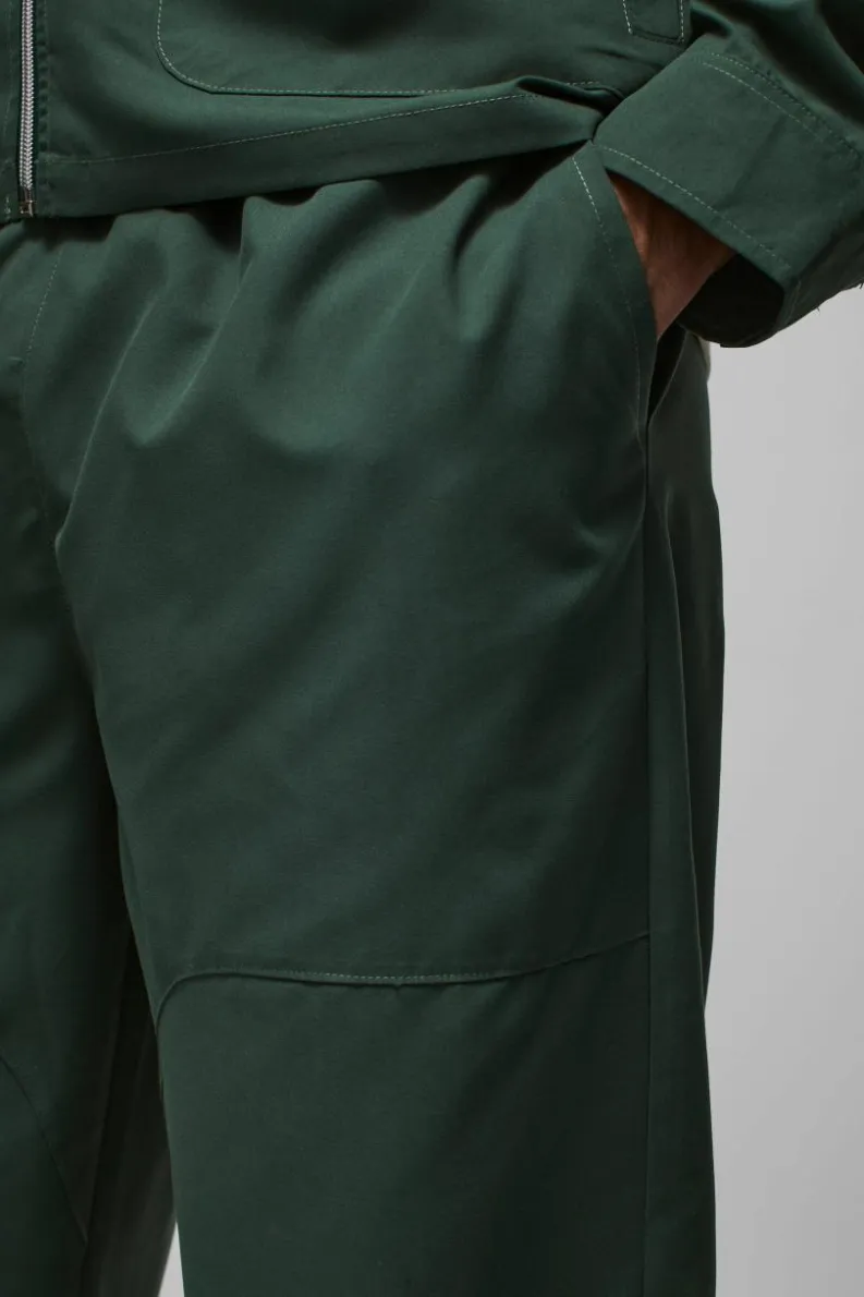 Online boohooMAN Relaxed Fit Panel Detail Elasticated Waist Nylon Trouser forest
