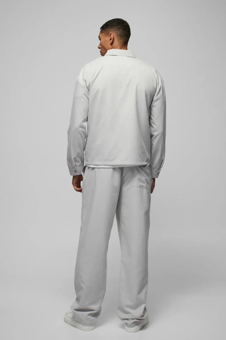 Outlet boohooMAN Relaxed Fit Panel Detail Elasticated Waist Nylon Trouser light grey