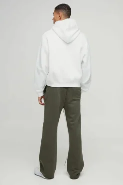 Shop boohooMAN Relaxed Flare Worldwide Star Gusset Jogger khaki