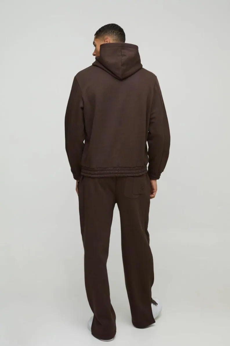 Store boohooMAN Relaxed Heavyweight Embossed Pocket Detail Split Hem Joggers chocolate