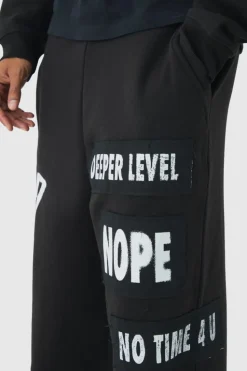 Flash Sale boohooMAN Relaxed Wide Leg Graffiti Applique Distressed Joggers black