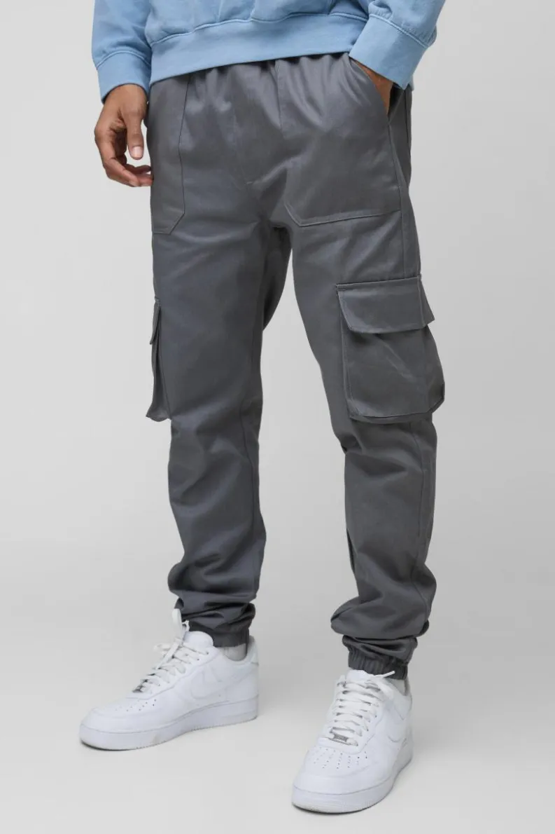 Shop boohooMAN Skinny Fit Elasticated Waist Cuffed Cargo Trousers charcoal