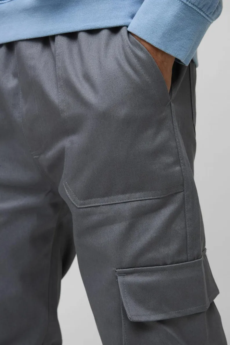 Shop boohooMAN Skinny Fit Elasticated Waist Cuffed Cargo Trousers charcoal