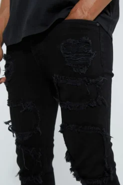 Shop boohooMAN Skinny Stacked Distressed Ripped Jeans true black