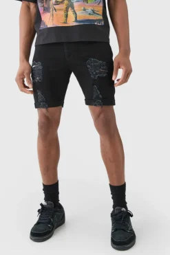 Store boohooMAN Skinny Stretch Distressed Denim Shorts In Black true black
