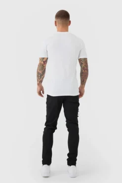 Shop boohooMAN Skinny Stretch Ripped Chain Jeans black