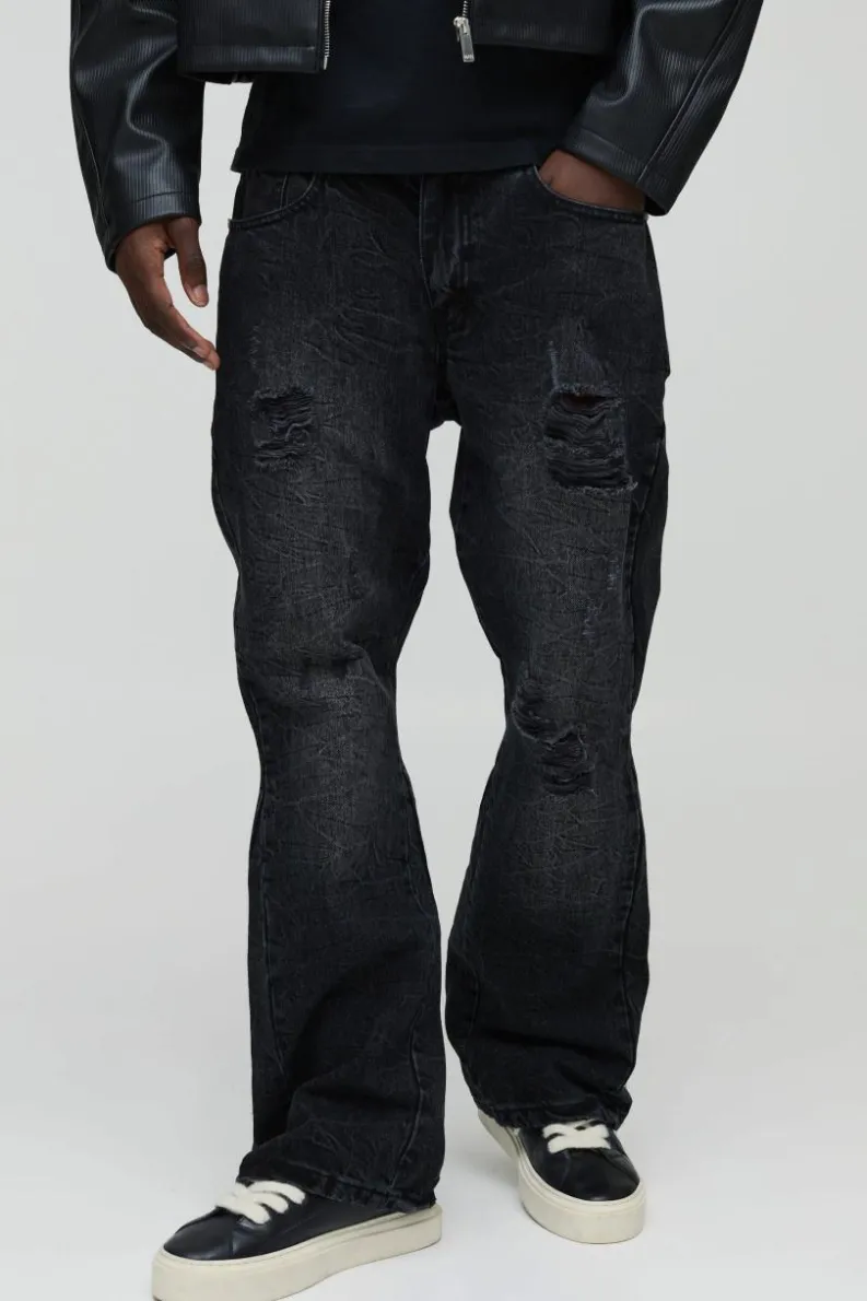 Store boohooMAN Slim Flared Ripped Washed Jeans charcoal