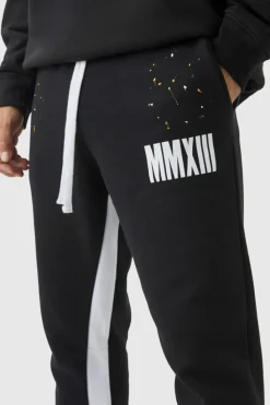 Sale boohooMAN Slim Flared Stacked Fit Man Paint Splatter Flared Joggers black