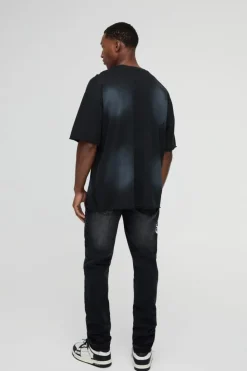 Shop boohooMAN Slim Rigid Paint Splat Ripped Jeans washed black