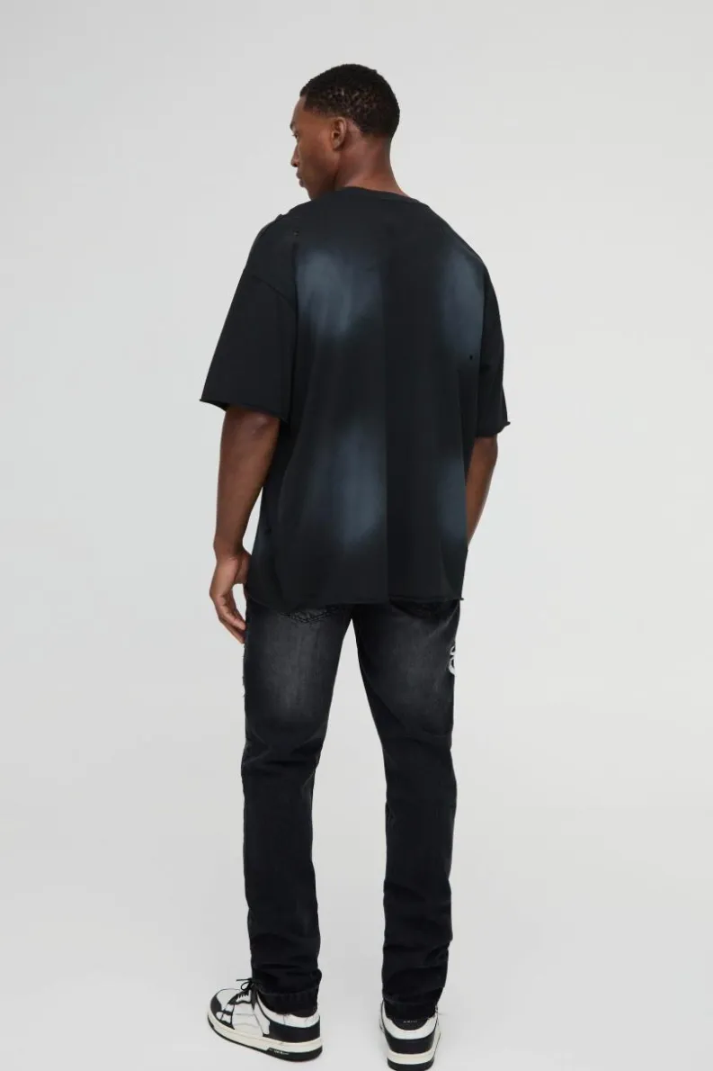 Shop boohooMAN Slim Rigid Paint Splat Ripped Jeans washed black