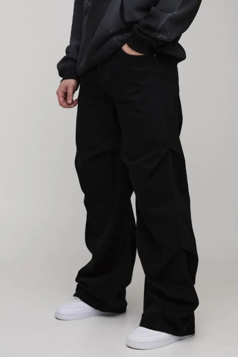 Shop boohooMAN Tall Baggy Ruched Detail Jeans washed black