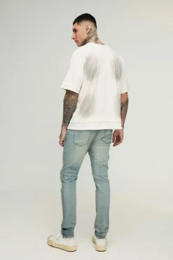 Store boohooMAN Tall Biker Rip & Repair Zip Hem Skinny Jeans stonewash