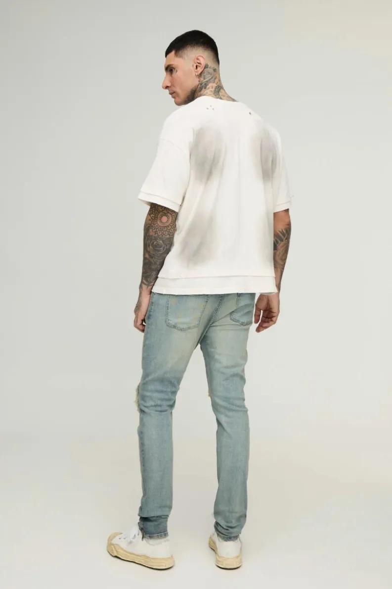 Store boohooMAN Tall Biker Rip & Repair Zip Hem Skinny Jeans stonewash