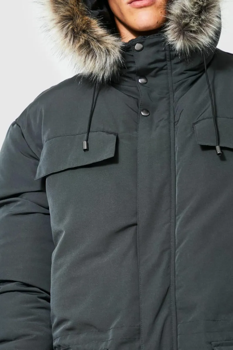 Shop boohooMAN Tall Faux Fur Hooded Arctic Parka Jacket in charcoal