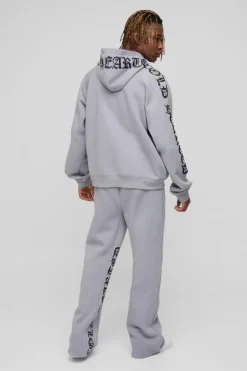 Shop boohooMAN Tall Oversized Boxy Gothic Heart Print Gusset Hooded Tracksuit grey marl