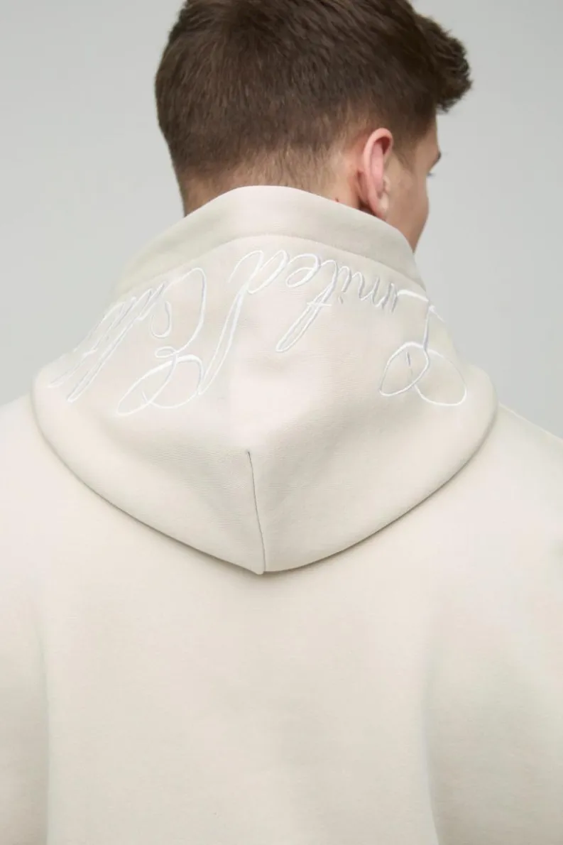 Shop boohooMAN Tall Oversized Boxy Twill Applique Contrast Stitch Hoodie stone