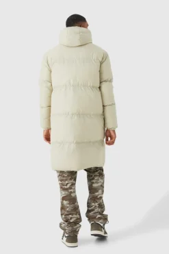 Store boohooMAN Tall 4 Pocket Longline Hooded Puffer Jacket in ecru
