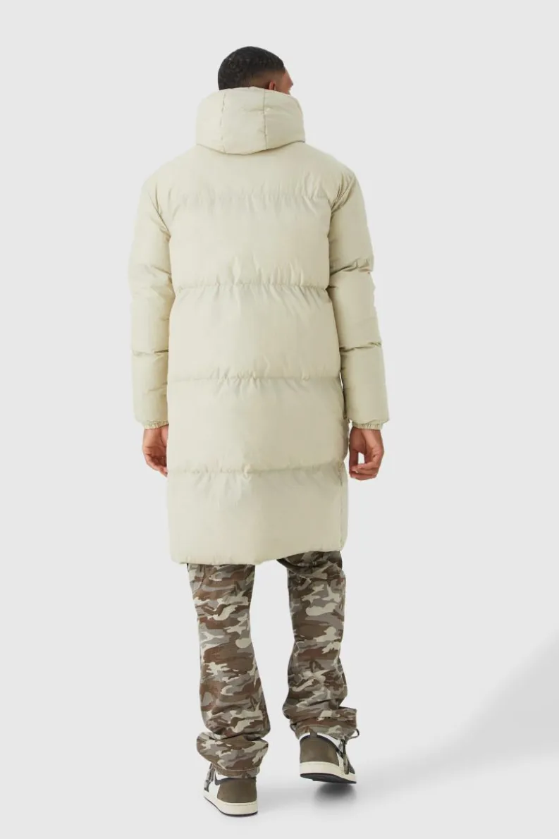 Store boohooMAN Tall 4 Pocket Longline Hooded Puffer Jacket in ecru