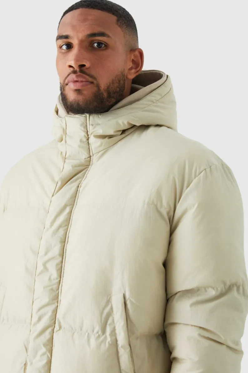Store boohooMAN Tall 4 Pocket Longline Hooded Puffer Jacket in ecru