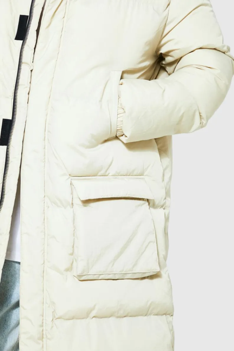 Store boohooMAN Tall 4 Pocket Longline Hooded Puffer Jacket in ecru