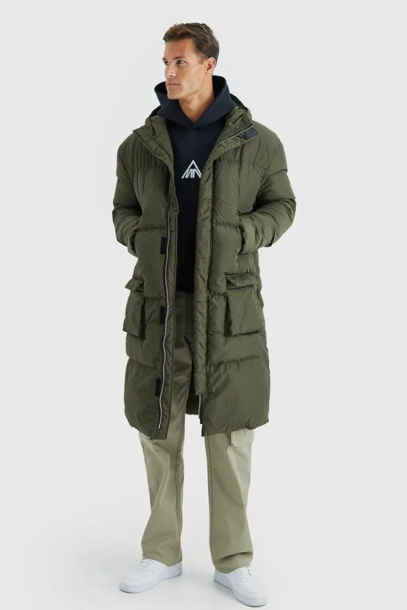 Shop boohooMAN Tall 4 Pocket Longline Hooded Puffer Jacket in khaki