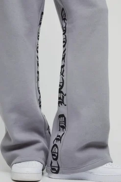 Hot boohooMAN Tall Relaxed Flare Cold Hearted Puff Print Gusset Jogger grey marl