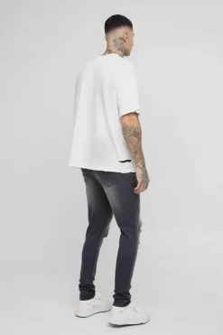 Hot boohooMAN Tall Skinny All Over Ripped Bleached Paint Splatter Jeans grey