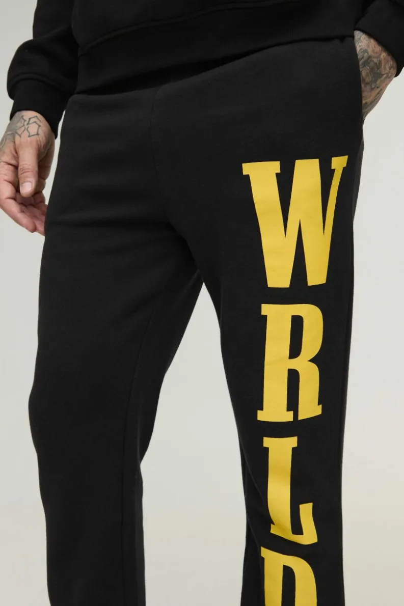 Shop boohooMAN Tall Slim Stacked Wrld Print Gusset Jogger black