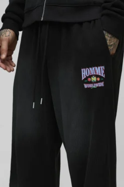 Fashion boohooMAN Tall Spray Wash Waffle Graphic Oversized Jogger washed black