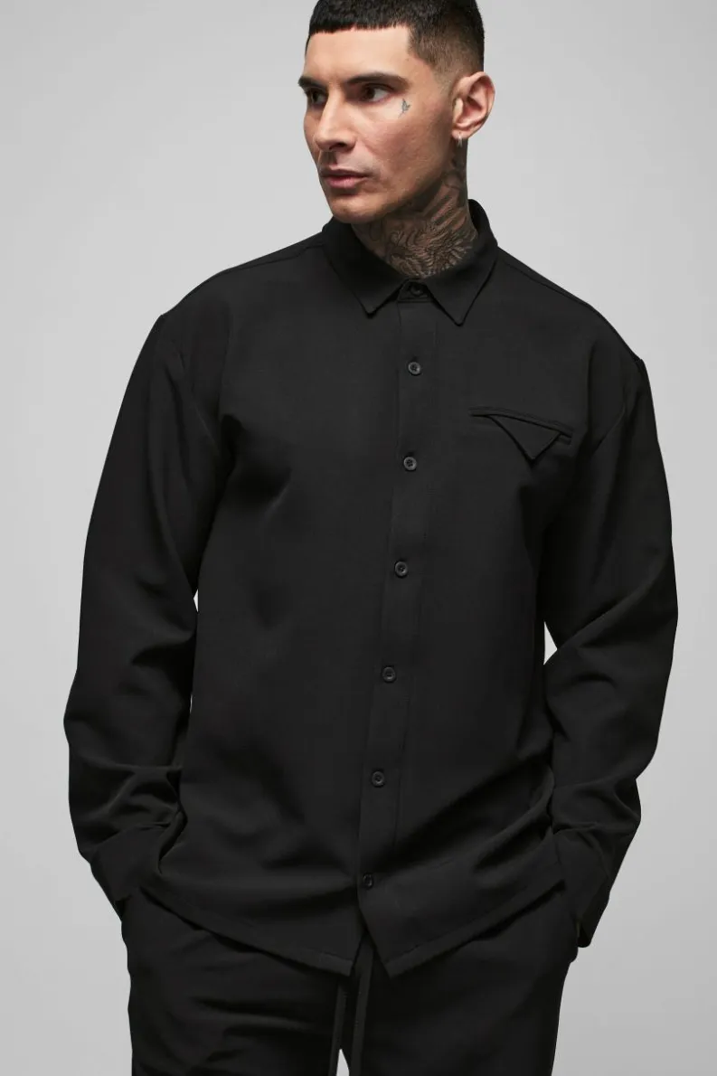 Shop boohooMAN Tall Stretch Woven Pocket Detail Oversized Shirt black