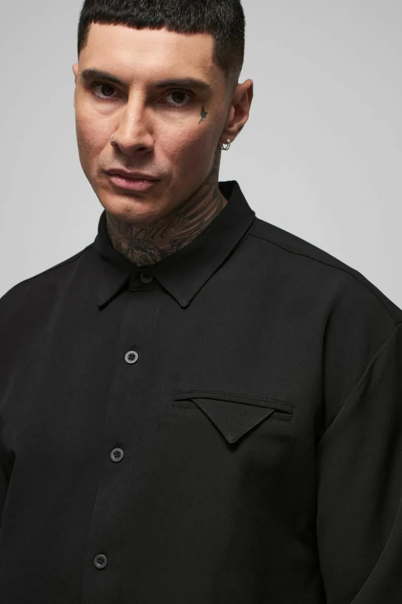Shop boohooMAN Tall Stretch Woven Pocket Detail Oversized Shirt black