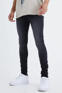 Shop boohooMAN Tall Super Skinny Stretch Jeans washed black
