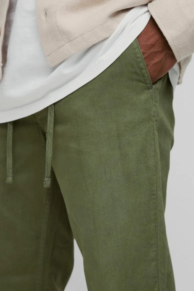 New boohooMAN Tapered Chinos With Drawcords In khaki