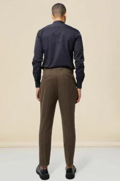 Shop boohooMAN Tapered Fit Herringbone Suit Trousers brown
