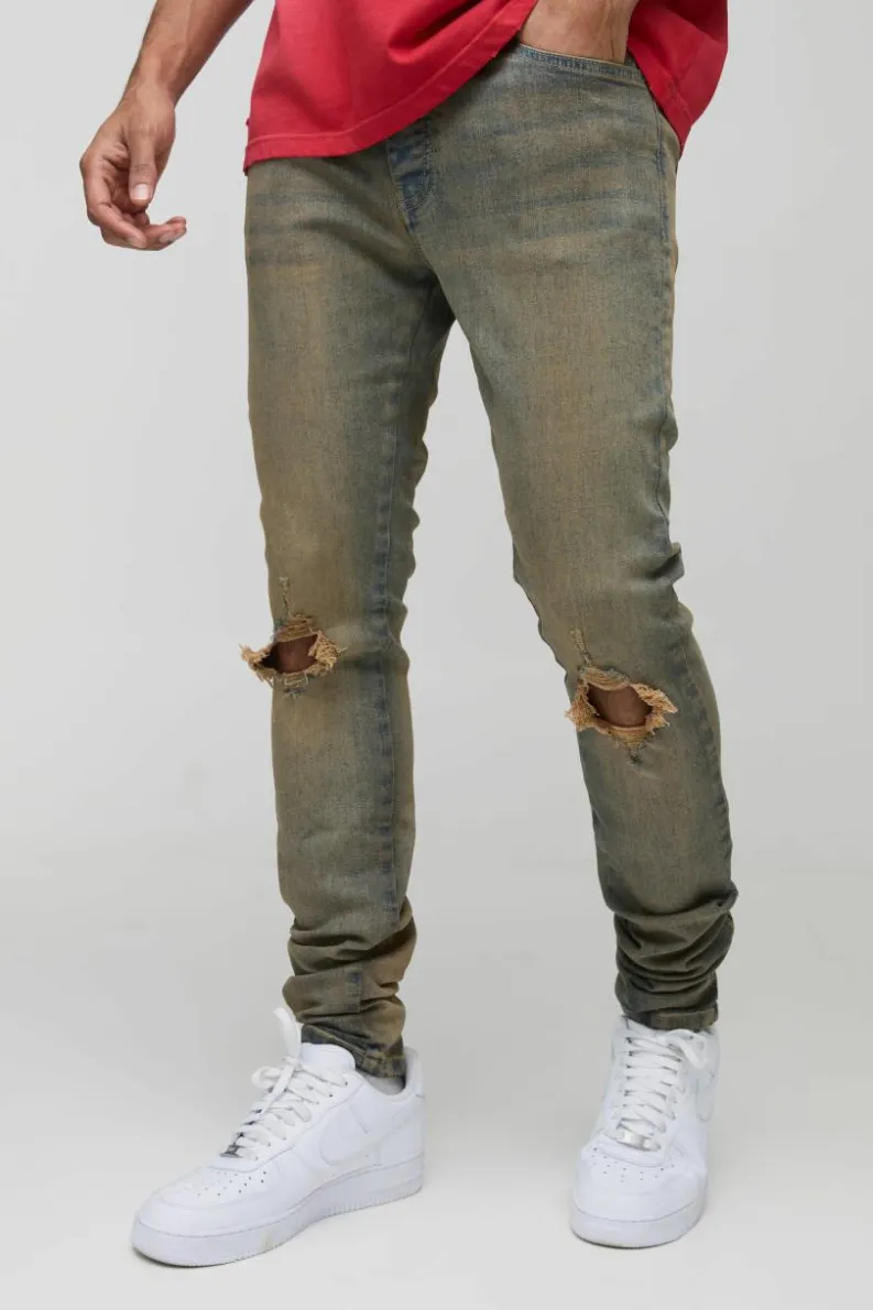 Store boohooMAN Tinted Rip Knee Stacked Skinny Zip Hem Jeans antique wash