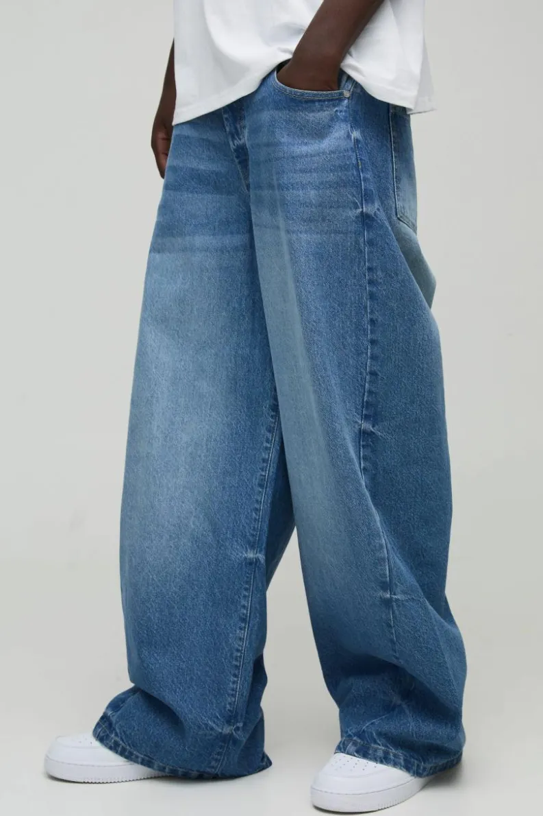 Shop boohooMAN Twist Seam Parachute Jeans light wash